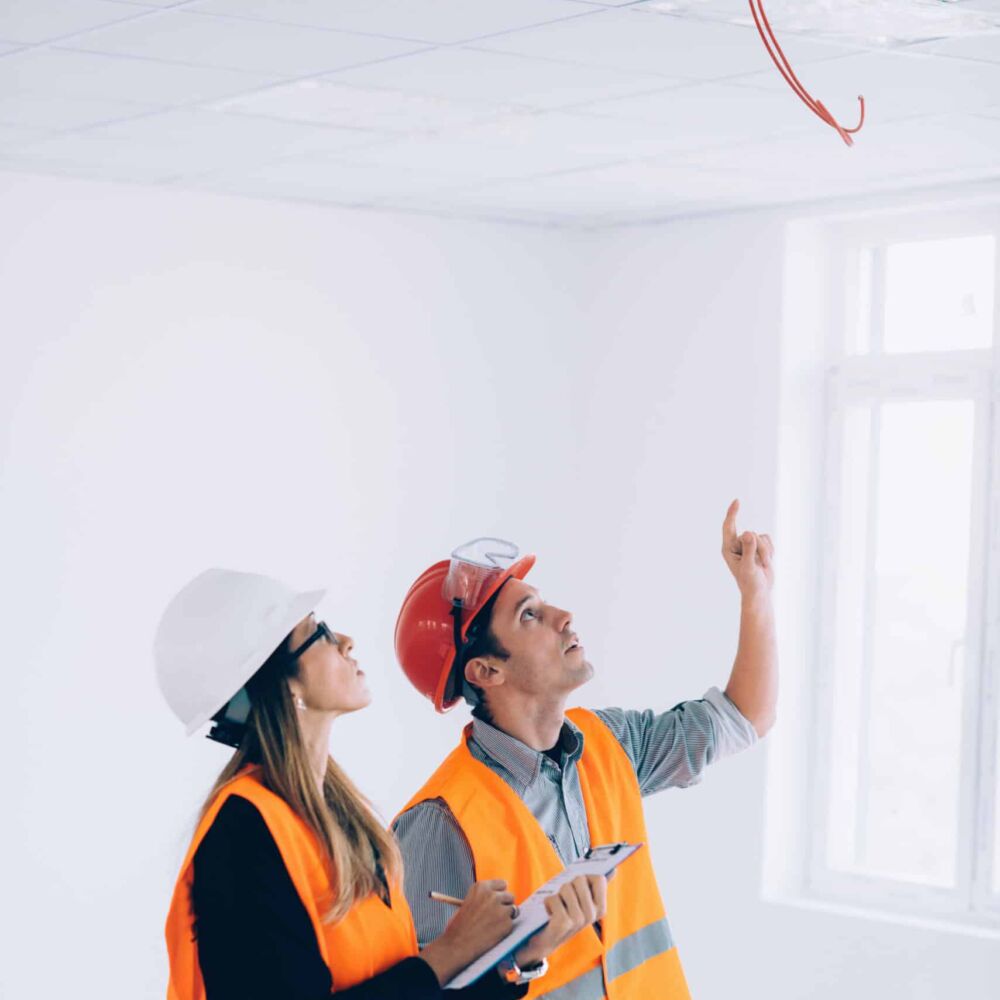 Maintenance Engineers checking cables for fire alarm